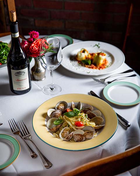 A spread of food with a clam dish